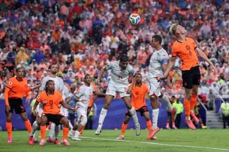 Jan-Paul van Hecke (right) flicks home the Netherlands’ third