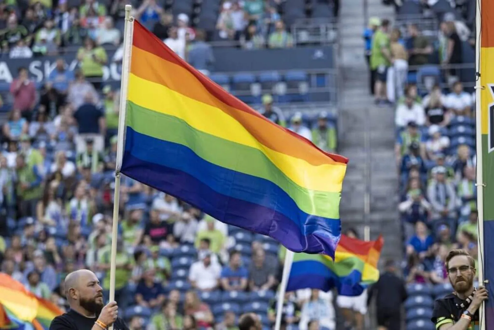 A pride flag ahead of a Seattle Sounders game