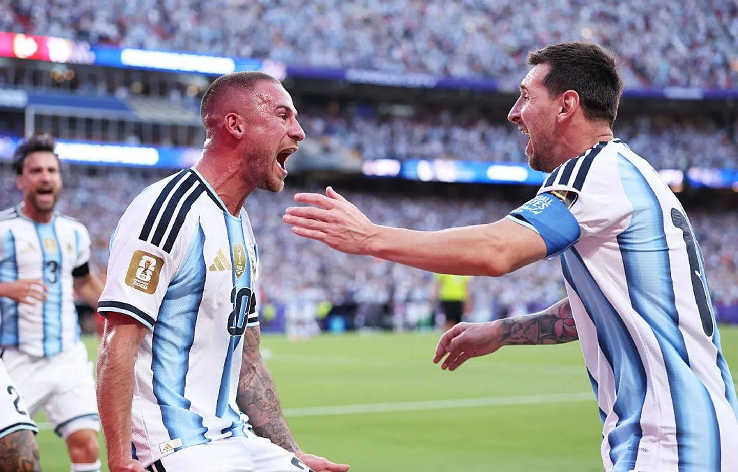 KANSAS CITY, MISSOURI - JULY 11: Alexis Mac Allister #20 of Argentina celebrates with Lionel Messi #10 after scoring the team's first goal during the FIFA World Cup 2026 Quarter Final match between Argentina and Switzerland at Kansas City Stadium on July 11, 2026 in Kansas City, Missouri. (Photo by Kevin C. Cox/Getty Images)