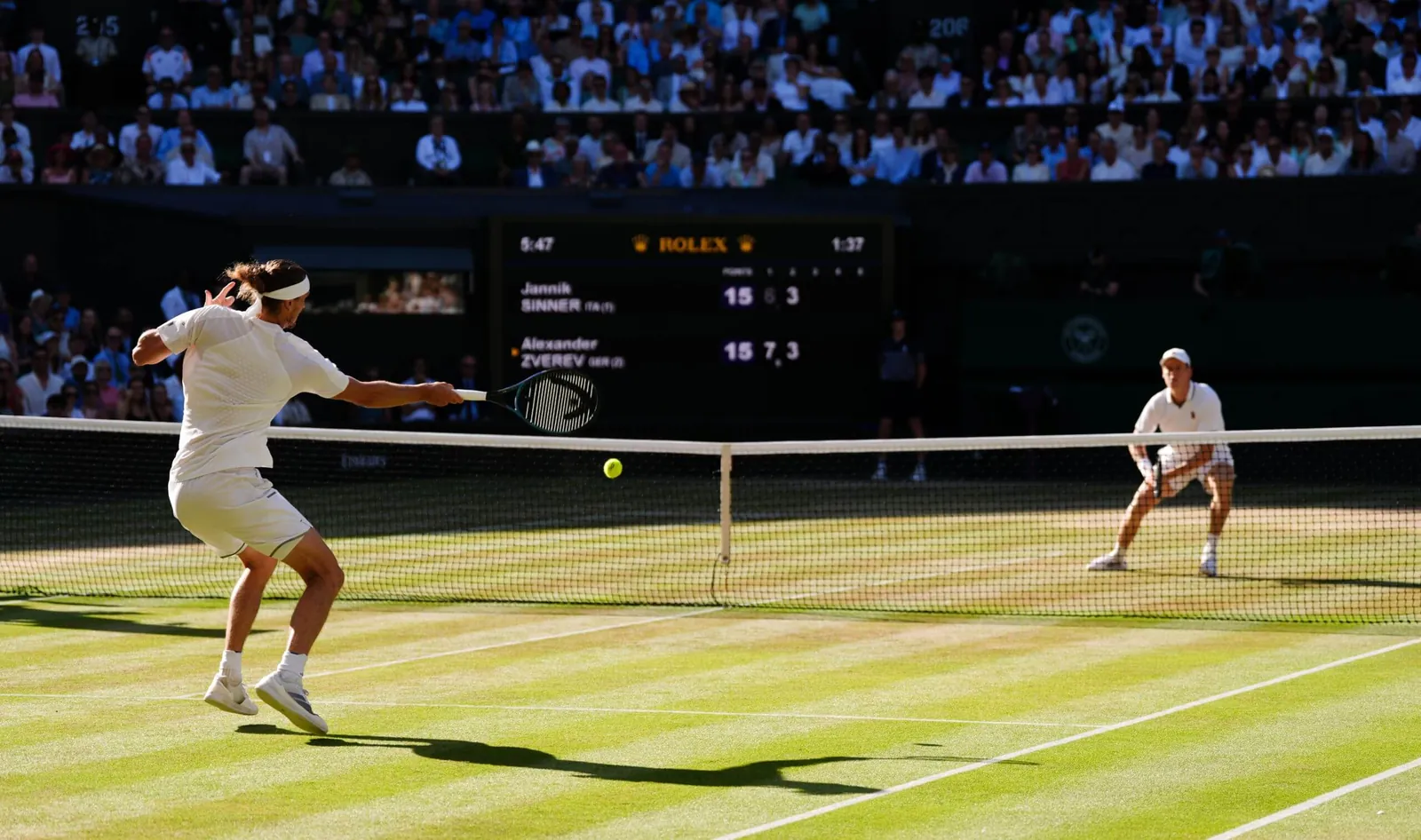 Alexander Zverev hits a forehand short in the court against Jannik Sinner