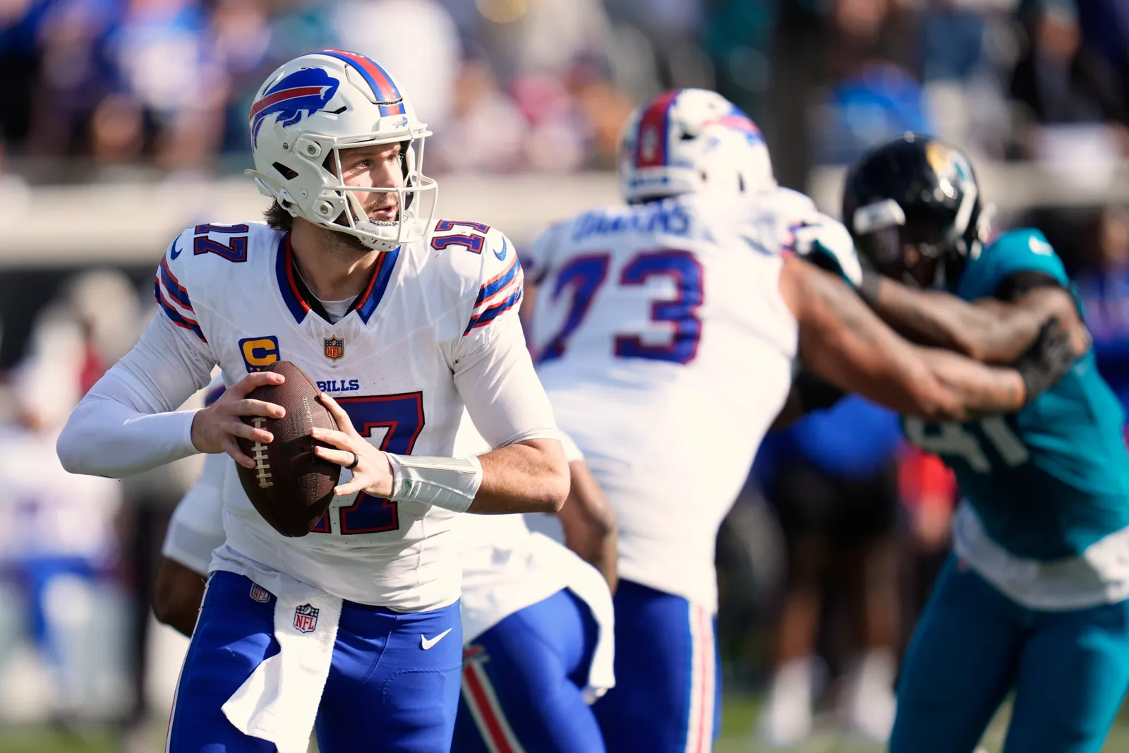 Buffalo Bills quarterback Josh Allen (17) looks for a receiver during the second half of an NFL wild card playoff football game against the Jacksonville Jaguars, Jan. 11, 2026, in Jacksonville, Fla. (AP Photo/John Raoux, File)