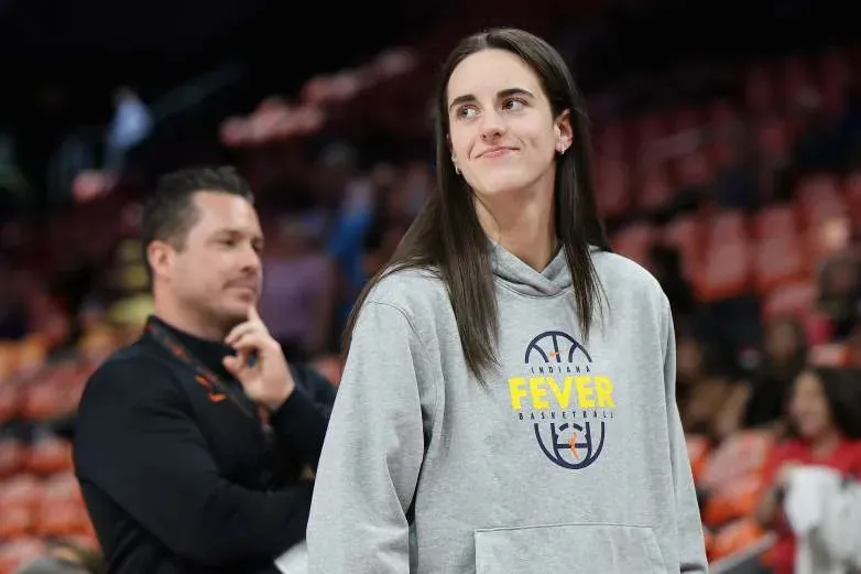 PHOENIX, ARIZONA - JULY 09: Caitlin Clark #22 of the Indiana Fever watches warm ups before the WNBA game against the Phoenix Mercury at Mortgage Matchup Center on July 09, 2026 in Phoenix, Arizona. The Fever defeated the Mercury 92-89. NOTE TO USER: User expressly acknowledges and agrees that, by downloading and or using this photograph, User is consenting to the terms and conditions of the Getty Images License Agreement. (Photo by Christian Petersen/Getty Images)