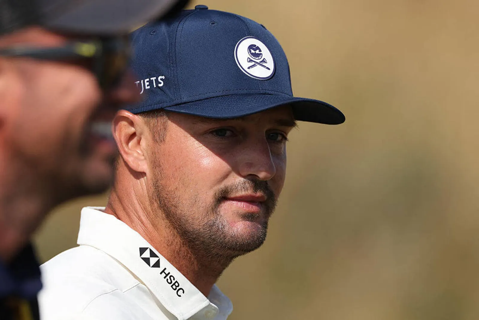 US golfer Bryson DeChambeau leaves the 1st tee on day one of the 154th Open Golf championship at Royal Birkdale Golf Club near Southport in north-west England on July 16, 2026.