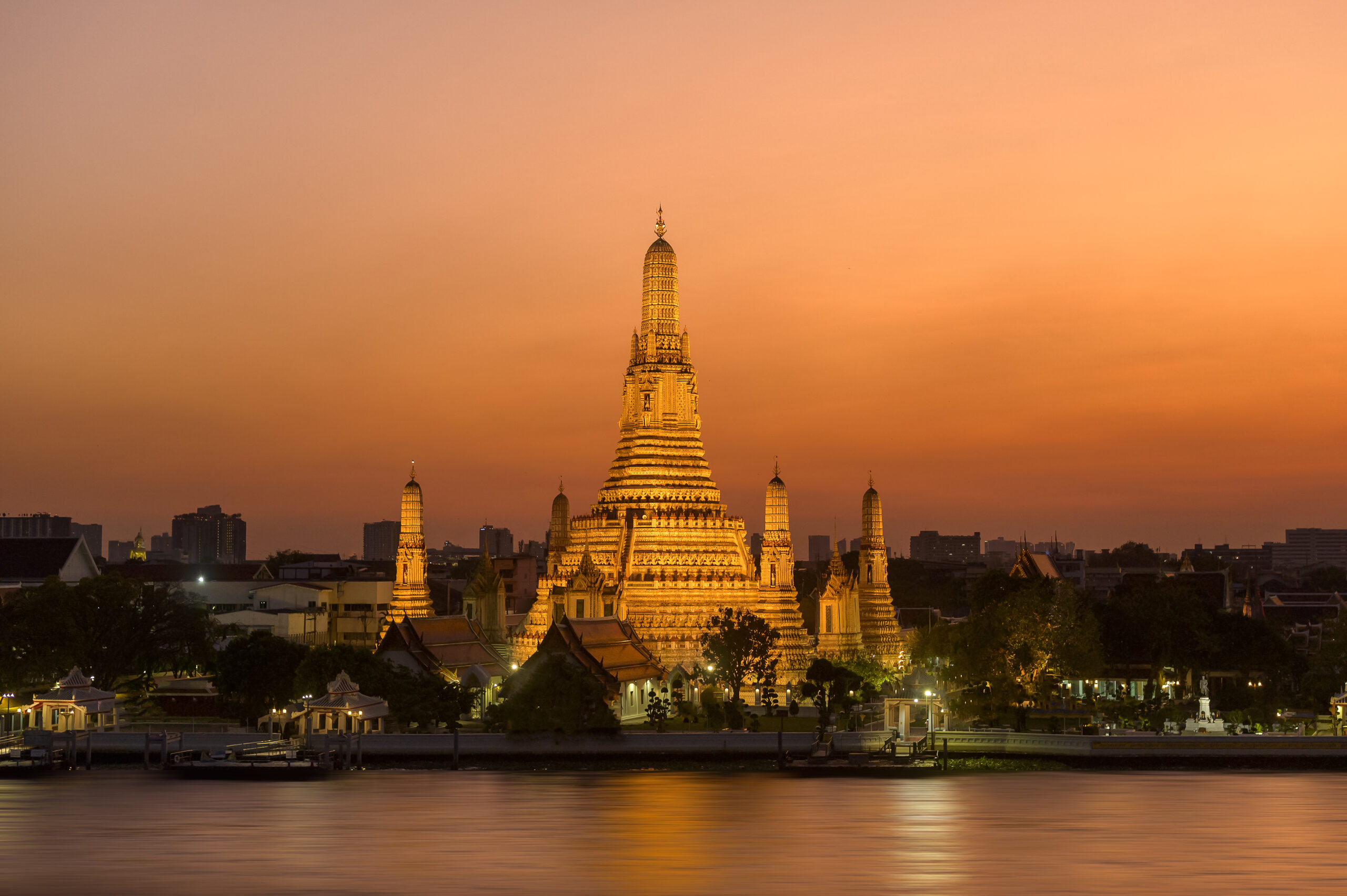 Beautiful view of Wat Arun Buddhist temple at sunset in Bangkok, Thailand