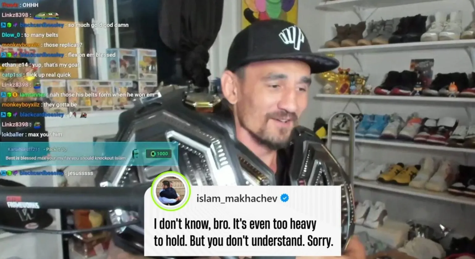 Max Holloway poses with various UFC belts during a recent stream