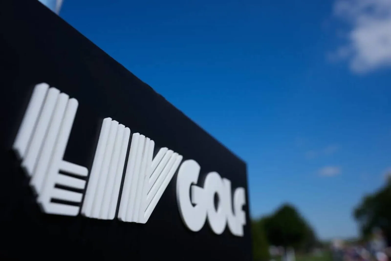 A close up of a sign with the LIV Golf logo